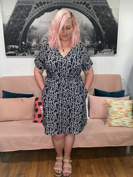 Face printed dress with pockets. Diversity print. multi cultural print. Short sleeve. v-neck. fun and unique dress. loose fitting dress. tunic dress. fun printed tunic dress. Belted dress. Long belted shirt dress.  Edit alt text