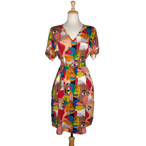 Face printed dress with pockets. Diversity print. multi cultural print. Short sleeve. v-neck. fun and unique dress. loose fitting dress. tunic dress. fun printed tunic dress. Belted dress. Long belted shirt dress.  Edit alt text