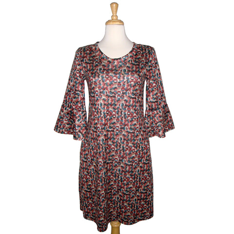 Fun knee length dress with pink, teal, and charcoal polka dots that over lay each other. Mod style print. 3/4 length sleeve with flounce cuff. crew neck style with pockets. fabric is stretchy knit with 2% spandex. other fabrics are rayon and poly.