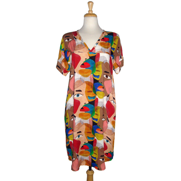 Face printed dress with pockets. Diversity print. multi cultural print. Short sleeve. v-neck. fun and unique dress. loose fitting dress. tunic dress. fun printed tunic dress. Belted dress. Long belted shirt dress.  Edit alt text